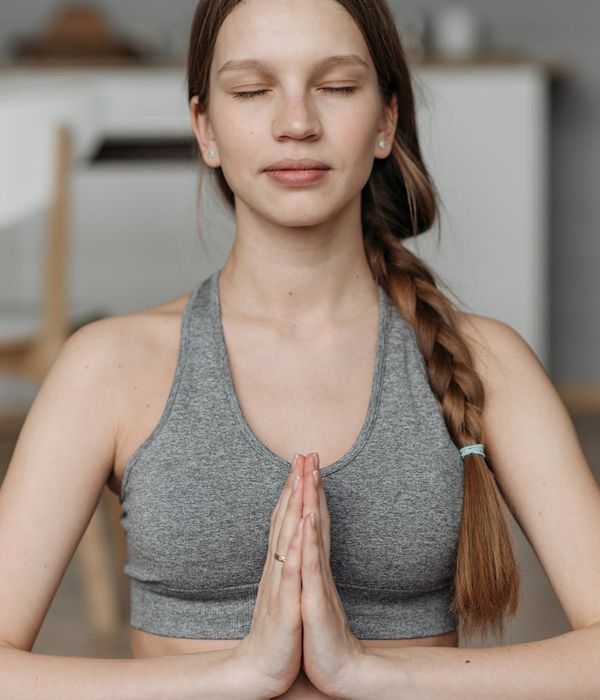 Woman practicing gentle yoga in a peaceful environment